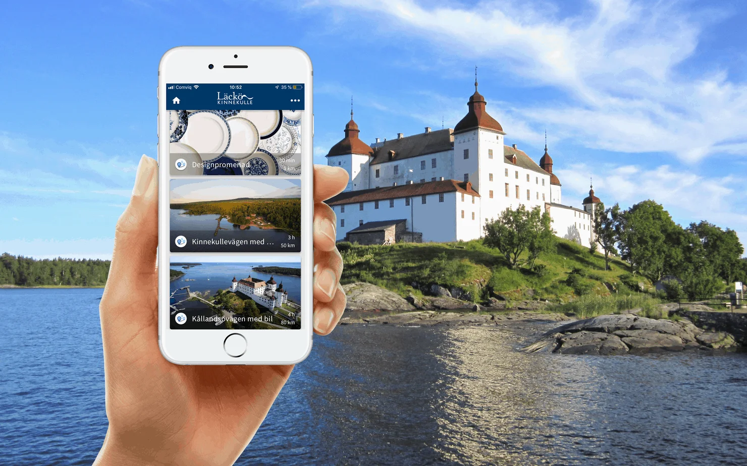 Bild på mobil framför bild på slott